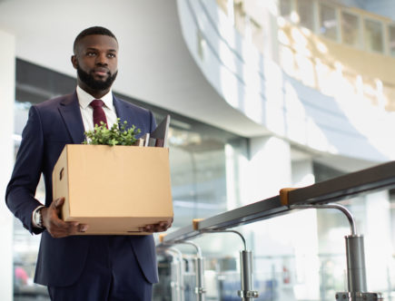 man-walking-with-a-box